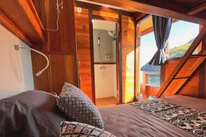 boat cabin bed bathroom wooden interior cozy travel accommodation